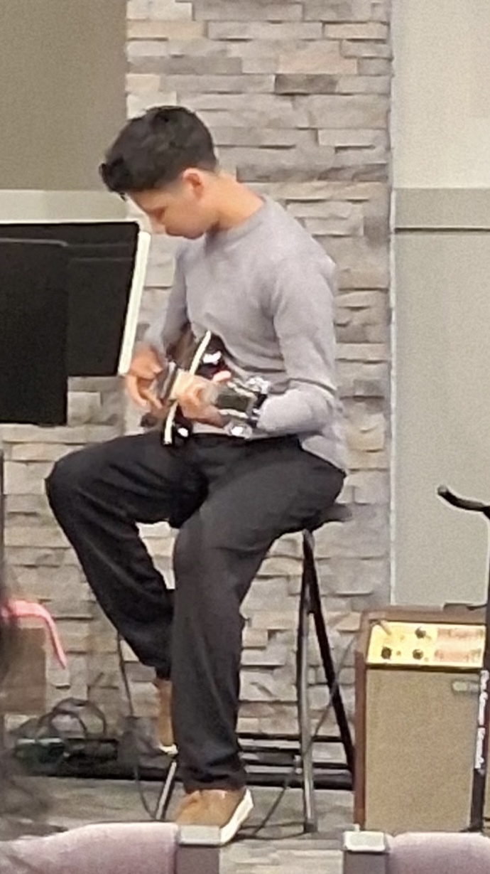 Student playing guitar